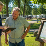 Technology consultant and campground owner reviewing future infrastructure improvements at an RV park